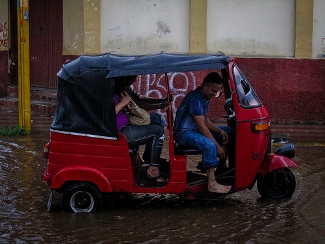 Autorickshaw stuck in clogged water