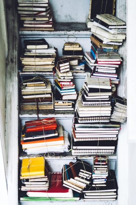 Stack of books. Read some of these to overcome writer's block.